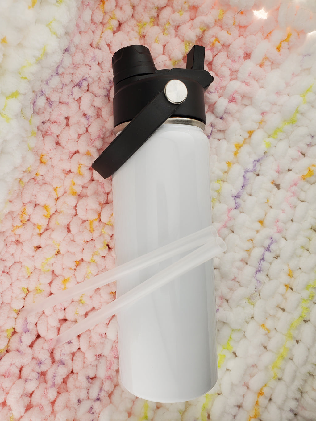 White sublimated Hydro style 18oz tumbler. With a 2-in-1 lid design: 1 side has a straw spout, and the other side is an open chug spout and 2 clear straws.