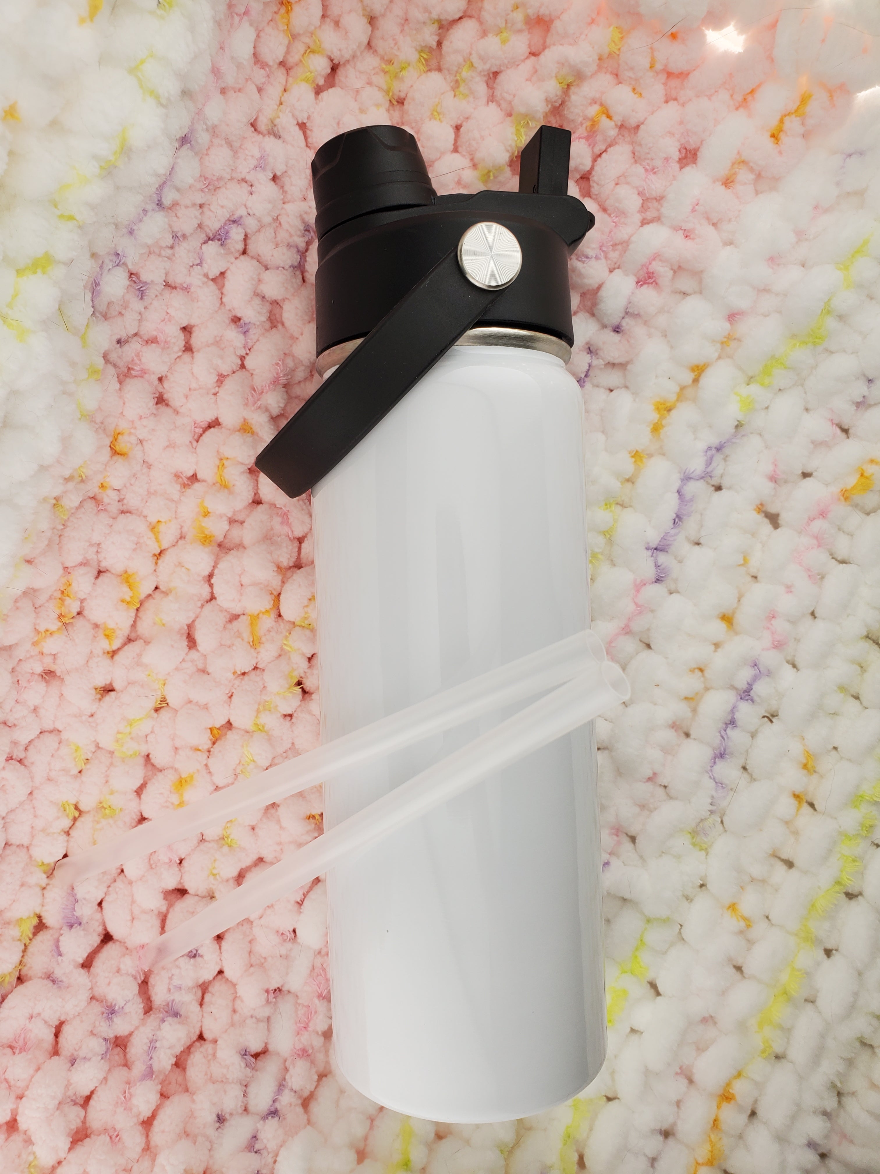 White sublimated Hydro style 18oz tumbler. With a 2-in-1 lid design: 1 side has a straw spout, and the other side is an open chug spout and 2 clear straws.