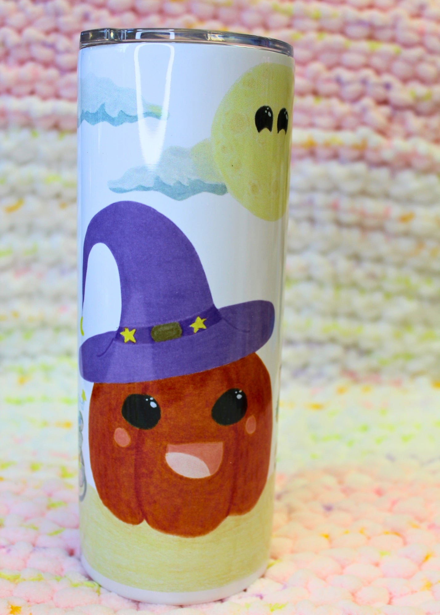 Hand-drawn cartoon witchy jack-o’-lantern with a witchy cat and mouse friend, with a big friendly moon looking on. Sublimated on a thick tumbler.