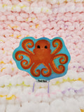 2 and a half-inch holographic vinyl sticker of an orange octopus. Octopus with tentacles in the shape of love hearts.