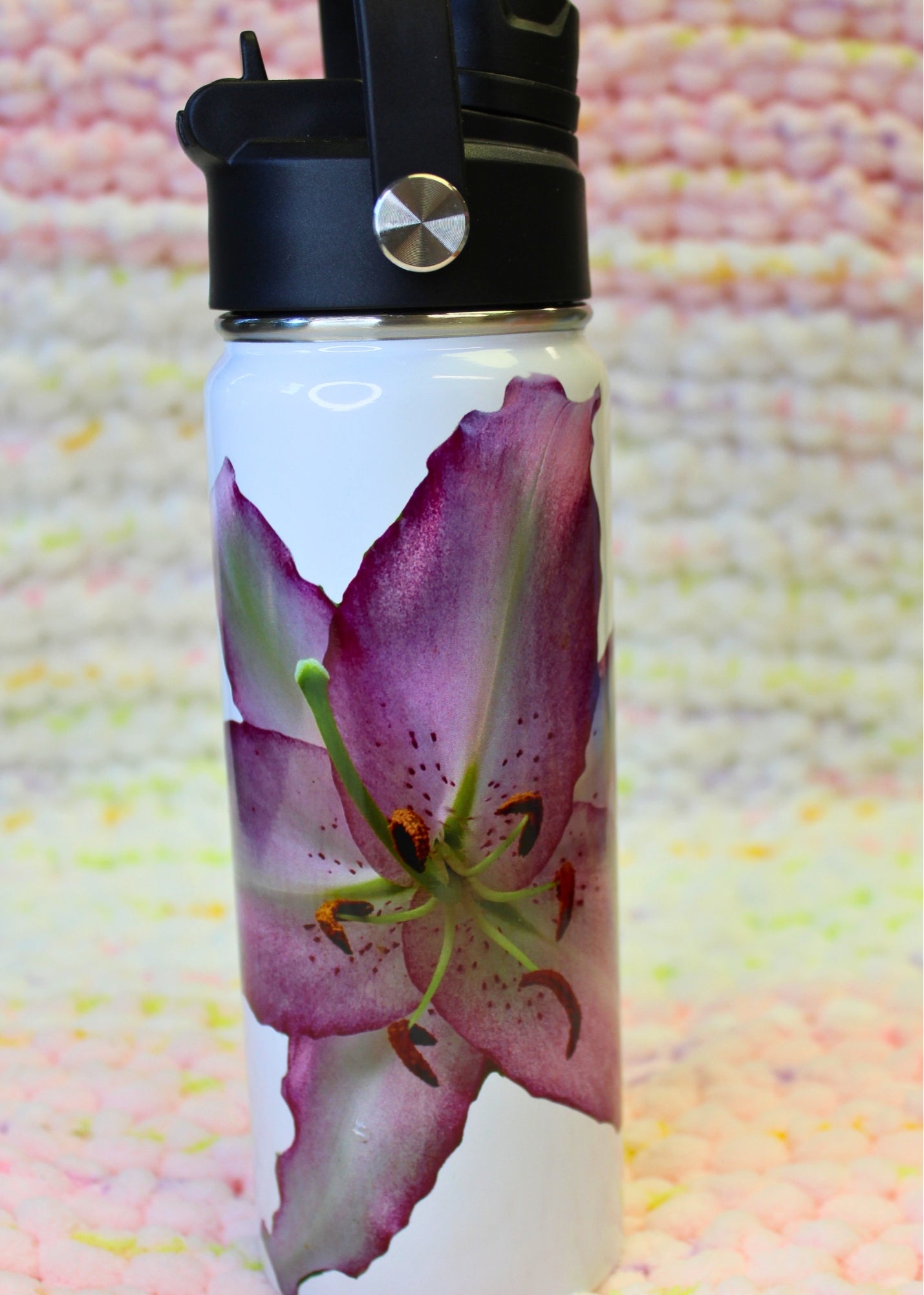  Photo of a Pink Lily on a hydro-style tumbler.