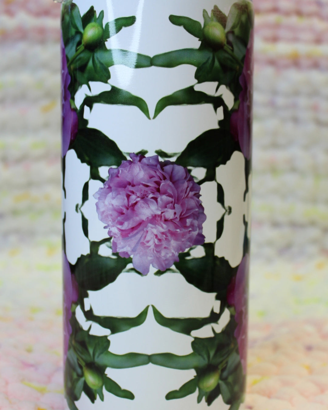 Photos of pink peonies arranged in a trippy pattern on a thick tumbler.